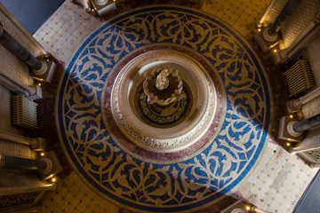 Top view from palace hall with a fountain in the center with the reflex of the sun light. Monserrate Place in Sintra Portugal