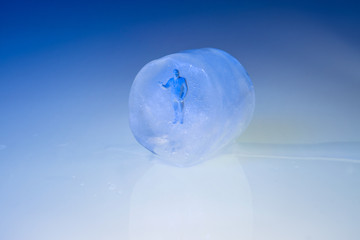 Plastic man frozen in an ice cube