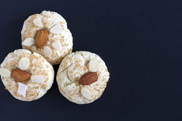 Chinese almond cookies on black background, top view