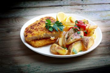 schnitzel and fried potatoes