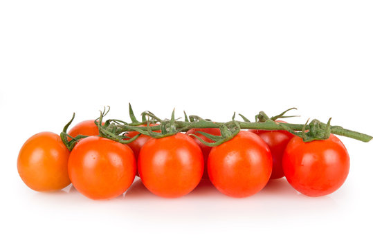 ripe cherry tomatoes on a white background