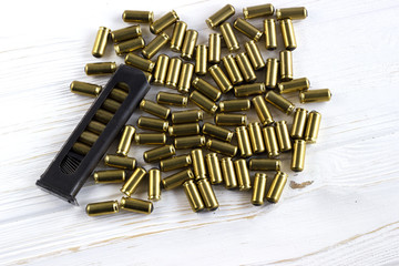 A lot of&ensp;bullets with a holder on white background