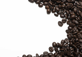 Background of coffee beans on the right bank on white background. Texture. Vertical shoot.