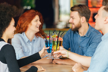 Friends drinking cocktail in bar