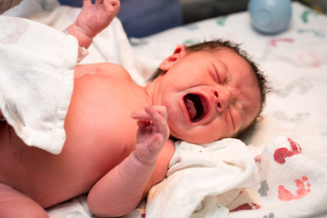 Sweet baby girl moments after being born