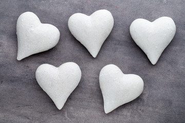 Red hearts the gray background. Valentine Day background.