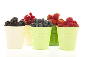 Buckets soft fruit isolated over white