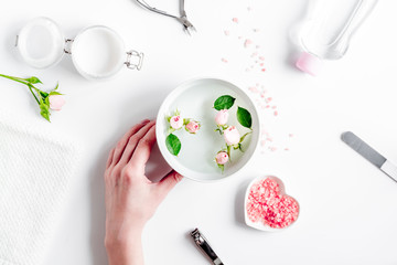 salt and cream for nail care in spa top view