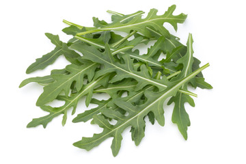 Close up studio shot of green fresh rucola isolated on white background.