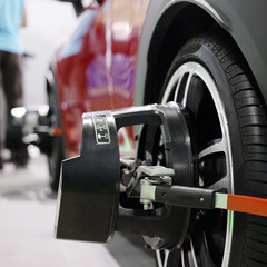 Wheel alignment equipment on a car wheel