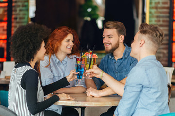 Friends drinking cocktail in bar