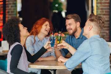Friends drinking cocktail in bar