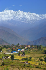 Nepali traditional village in front of Himalayas. Sibang, Dhaulagiri region.