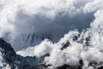 Naklejka premium Himalaya mountain landscape with peaks covered by snow and clouds