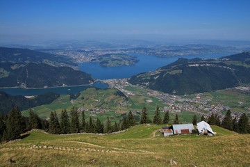 Fototapeta na wymiar Distant view of lake Vierwaldstattersee and Lucerne. View from Stanserhorn.