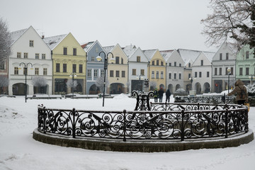 Obraz premium Well in the middle of town Zilina covered by snow. Slovakia