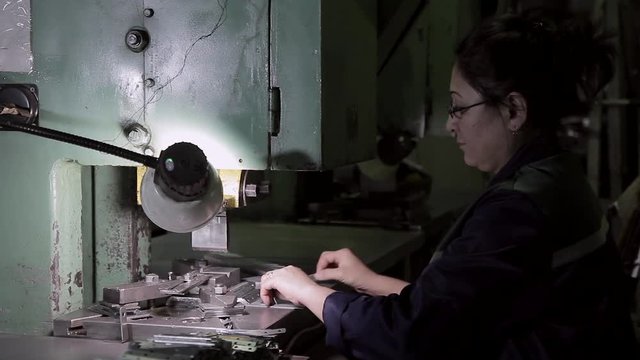 Woman worker on hard work in heavy industry