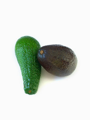 couple of avocados isolated on white