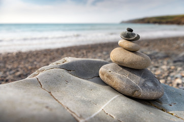 Fototapeta na wymiar Pile of smooth stones on the beach