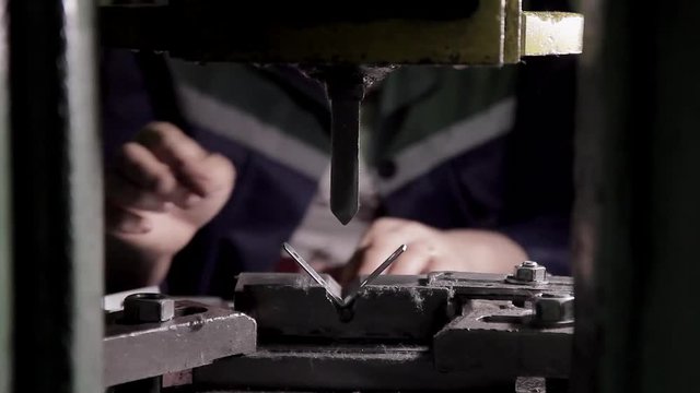 Close-up of a press for forming metal fasteners