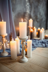Romantic interior for Valentine's day with candles lights burning in room.