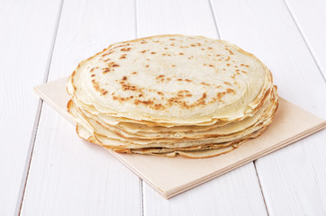 Pancakes on wooden background. Shrovetide