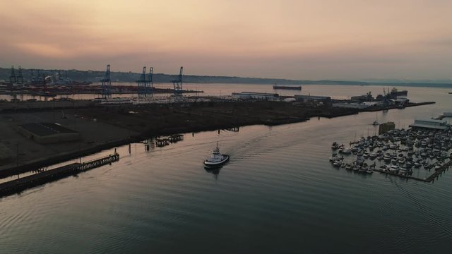 Tugboat aerial view along waterway