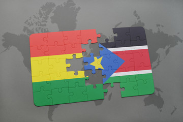 puzzle with the national flag of bolivia and south sudan on a world map