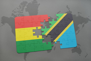 puzzle with the national flag of bolivia and tanzania on a world map