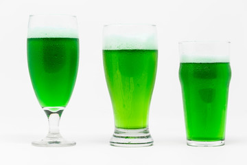 3 beer glasses, Belgian ale, classic pilsner and English pub with green beer isolated on white background.