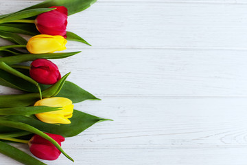 Wooden background with fresh tulips. Conception holiday, March 8, Mother's Day.