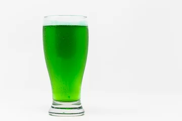 Dekokissen pilsner glass with green beer isolated on white background. © Satoshi Kina