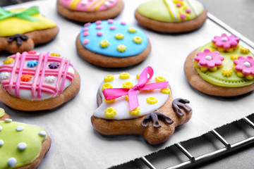 Obraz na płótnie Canvas Baking grid with colourful Easter cookies, closeup