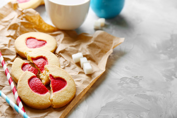 Cookies with parchment on grunge background, closeup