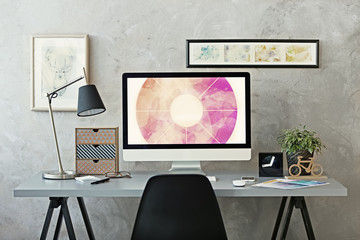 Workplace with computer on table in modern room