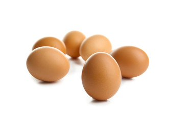Raw eggs on white background