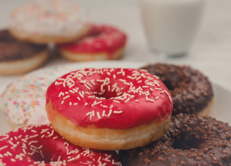 Tasty donuts on plate, closeup