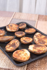 Baked potatoes with shell in the oven