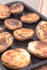 Baked potatoes in the oven with shell