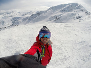 Fototapeta na wymiar Skier on snowing mountain