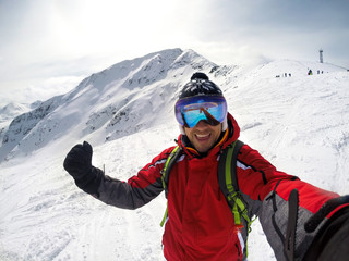 Fototapeta na wymiar Skier in winter ambience on mountain