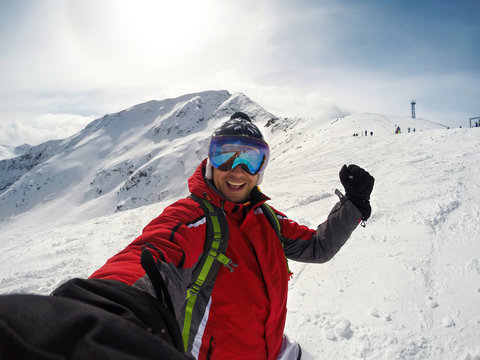 Selfie of man on snowy mountain