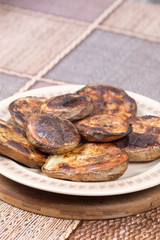 Baked potatoes with shell served on the plate