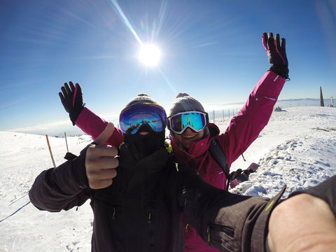 Skiers couple happy together in mountain