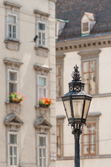 Fototapeta na wymiar Exquisite antique lantern on the central streets of Vienna, Austria 