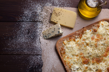 Pizza four cheese with oregano and olive oil. quattro fromaggi