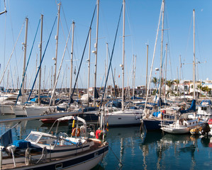 Fototapeta na wymiar Yachts and boats moored at marina. Sailing Boats. Canary Islands