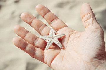 Man holding starfish