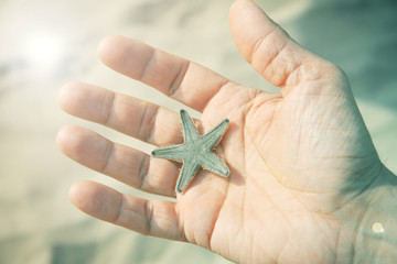 Man holding starfish
