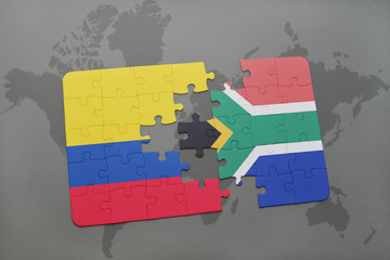 puzzle with the national flag of colombia and south africa on a world map